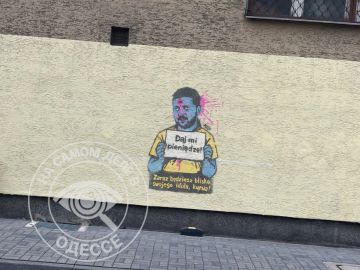 В Варшаве появились граффити с Зеленским в виде попрошайки с табличкой «Дай мне денег»